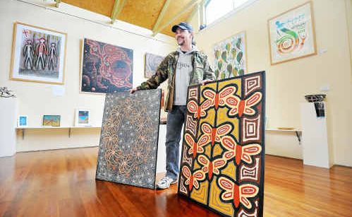 IN THE RUNNING: Artist Brentyn Lugnan with two works he has entered in Mid North Coast Indigenous Art Award. IN THE RUNNING: Artist Brentyn Lugnan with two works he has entered in Mid North Coast Indigenous Art Award.